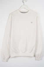 White sweatshirt on a hanger against a white background