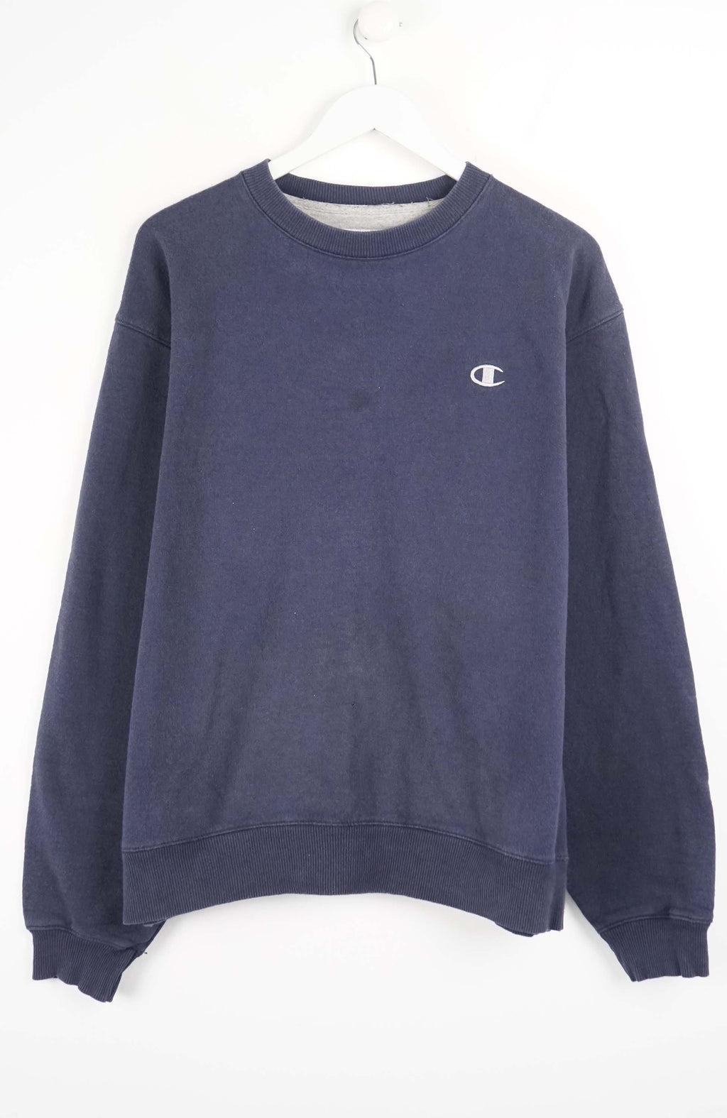 Navy blue sweatshirt with a small logo on a white background