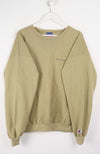 Beige sweatshirt with Champion logo on a white background