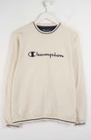 Beige sweatshirt with Champion logo on a white background