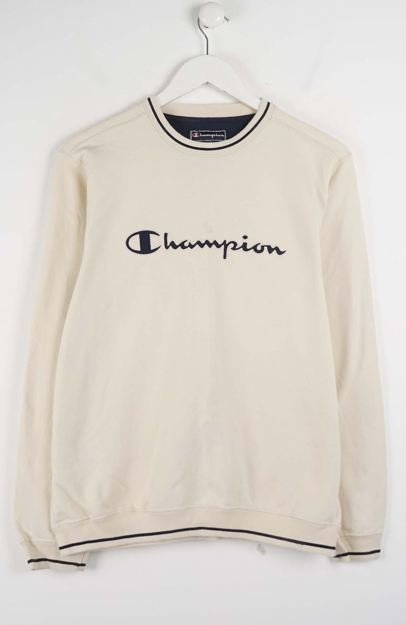 Beige sweatshirt with Champion logo on a white background