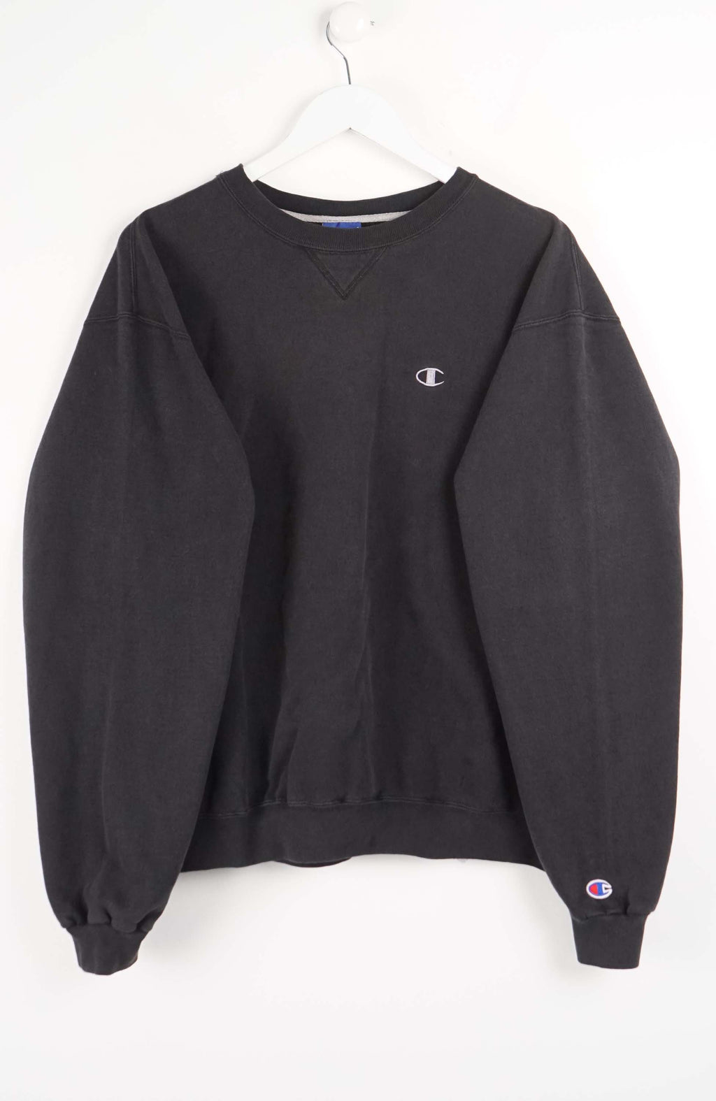 Black sweatshirt with Champion logo on a white background
