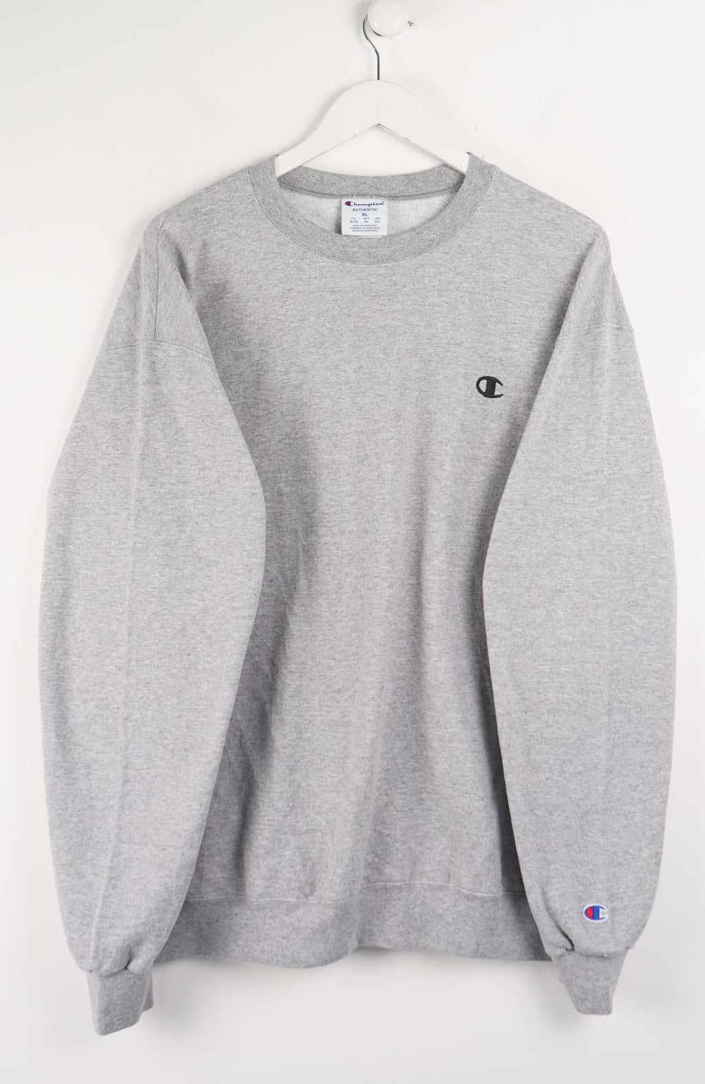 Gray sweatshirt with a small logo on a white background