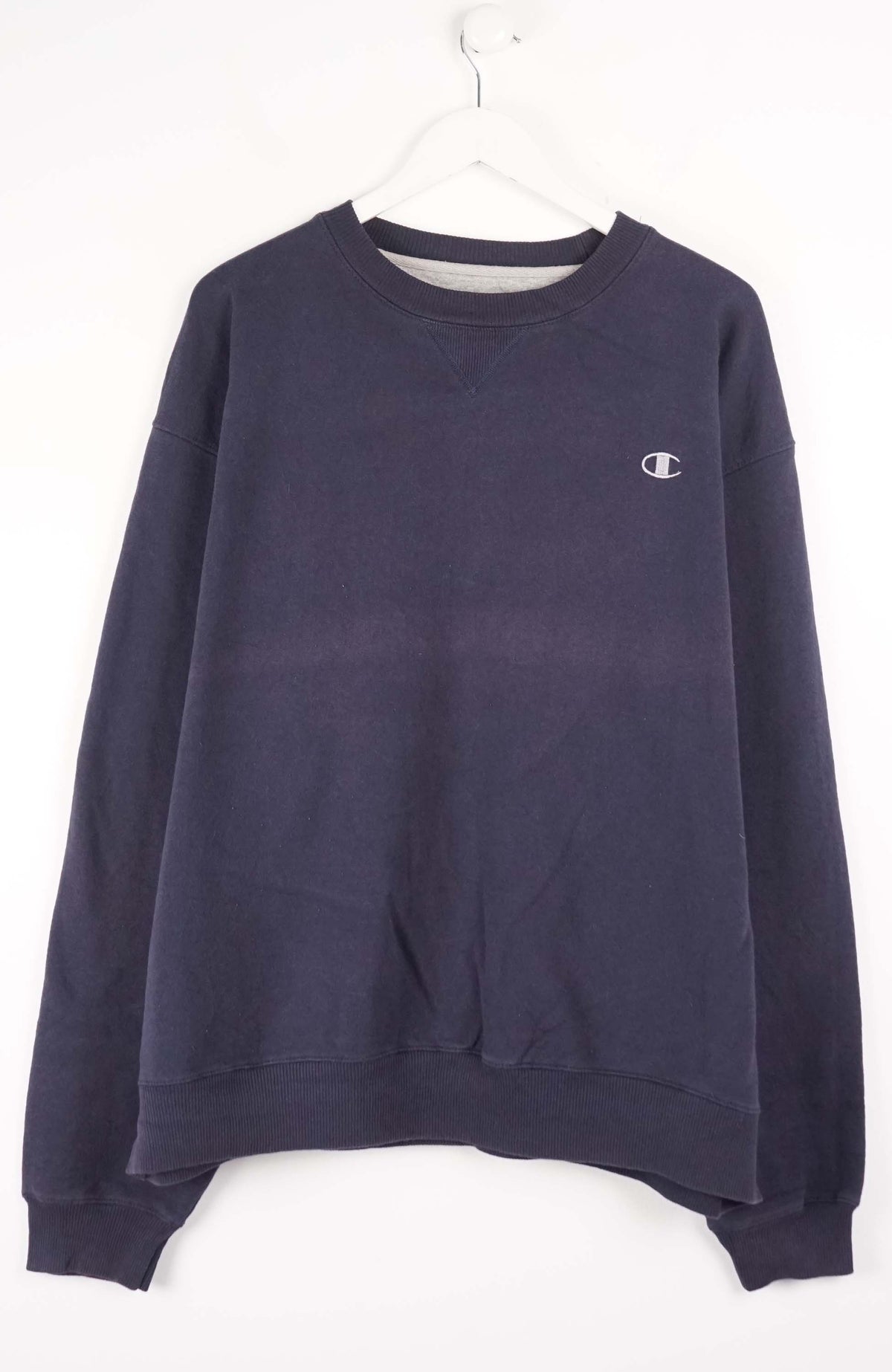 Navy blue sweatshirt with Champion logo on a white background