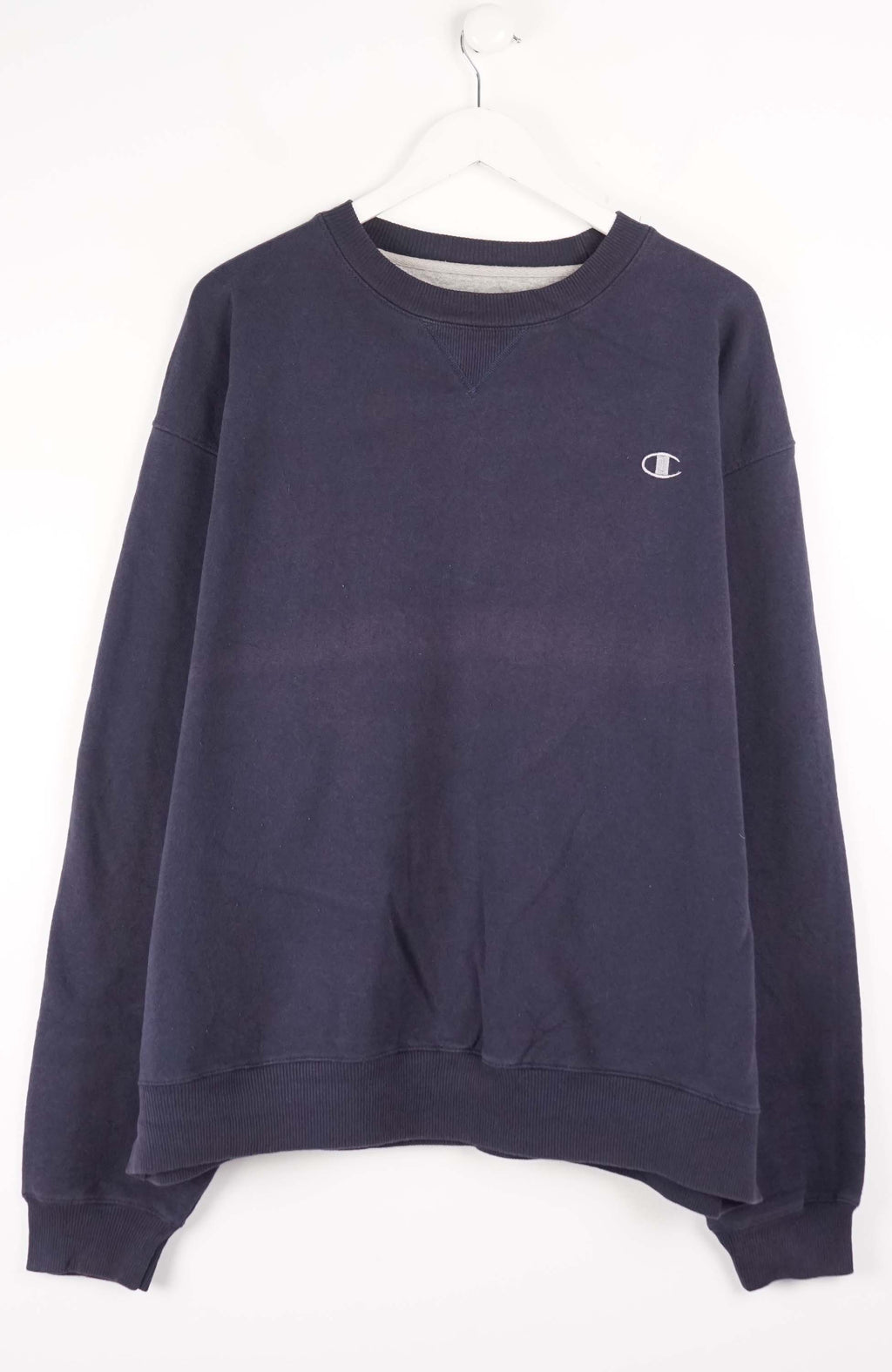 Navy blue sweatshirt with Champion logo on a white background