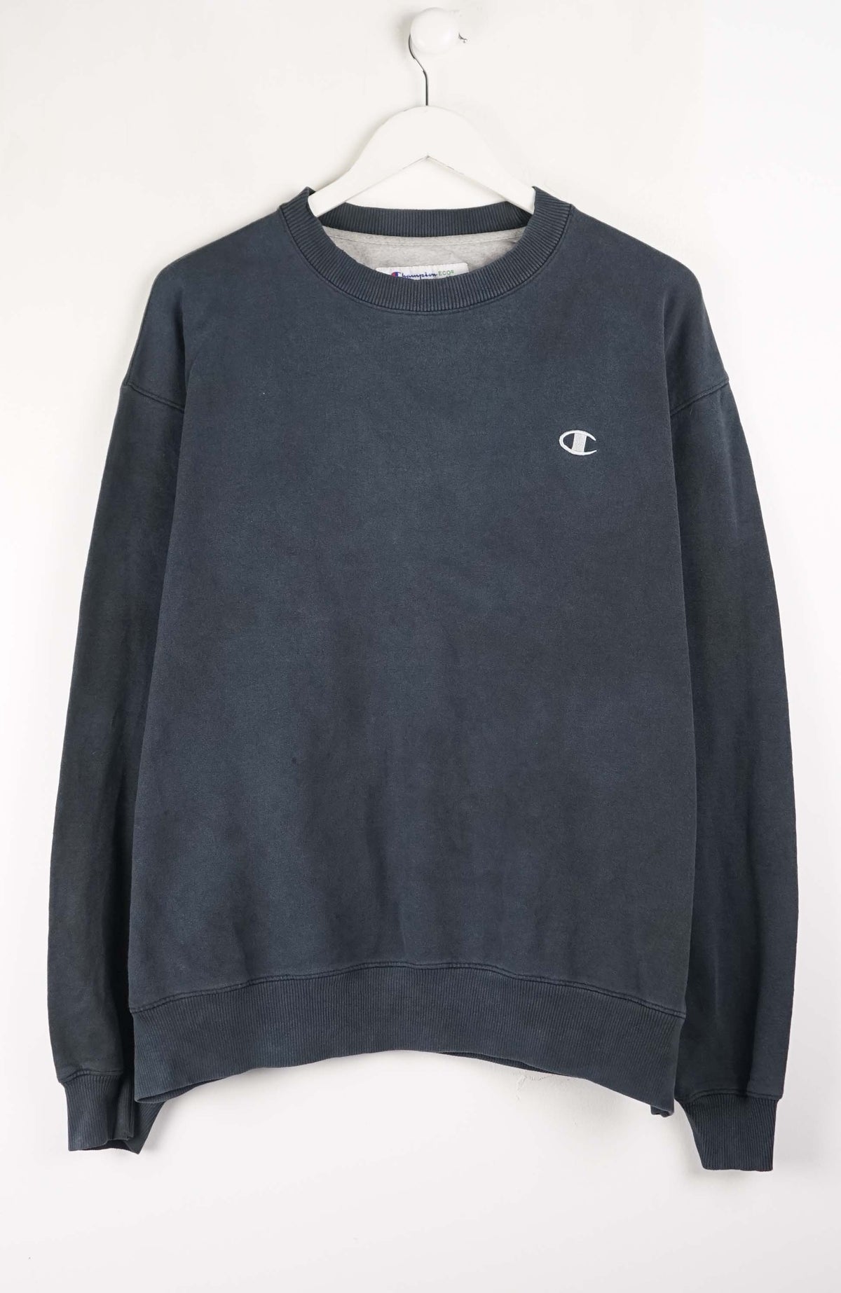 Navy blue sweatshirt with a small logo on a white background