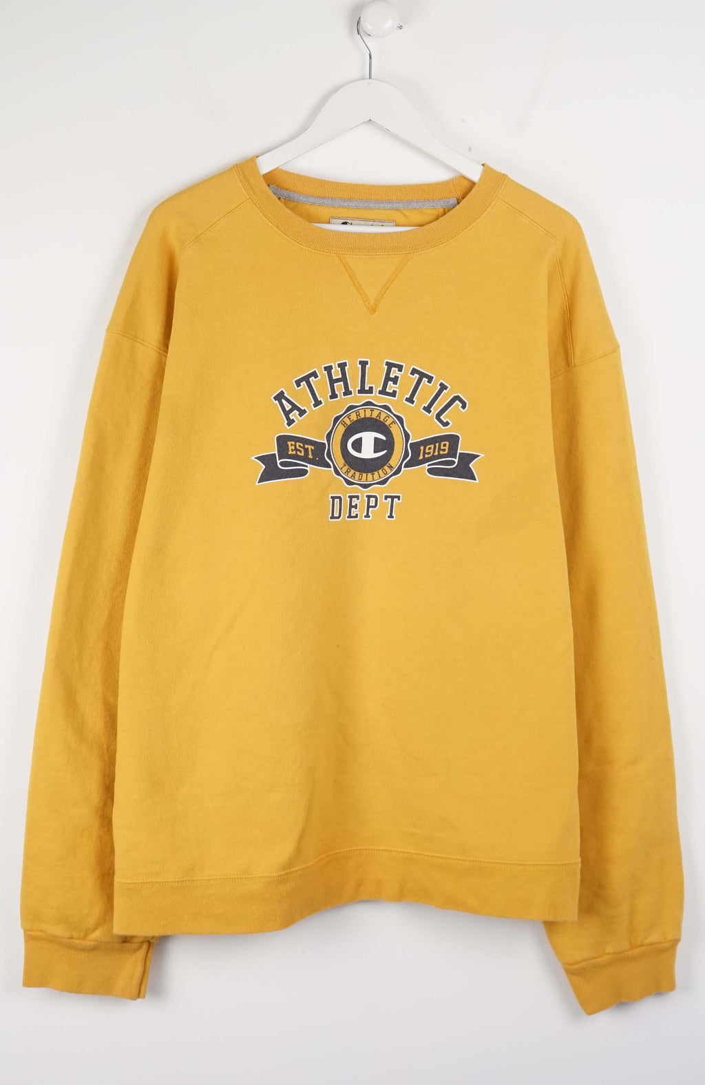 Yellow sweatshirt with 'Athletic Dept' print on a white background
