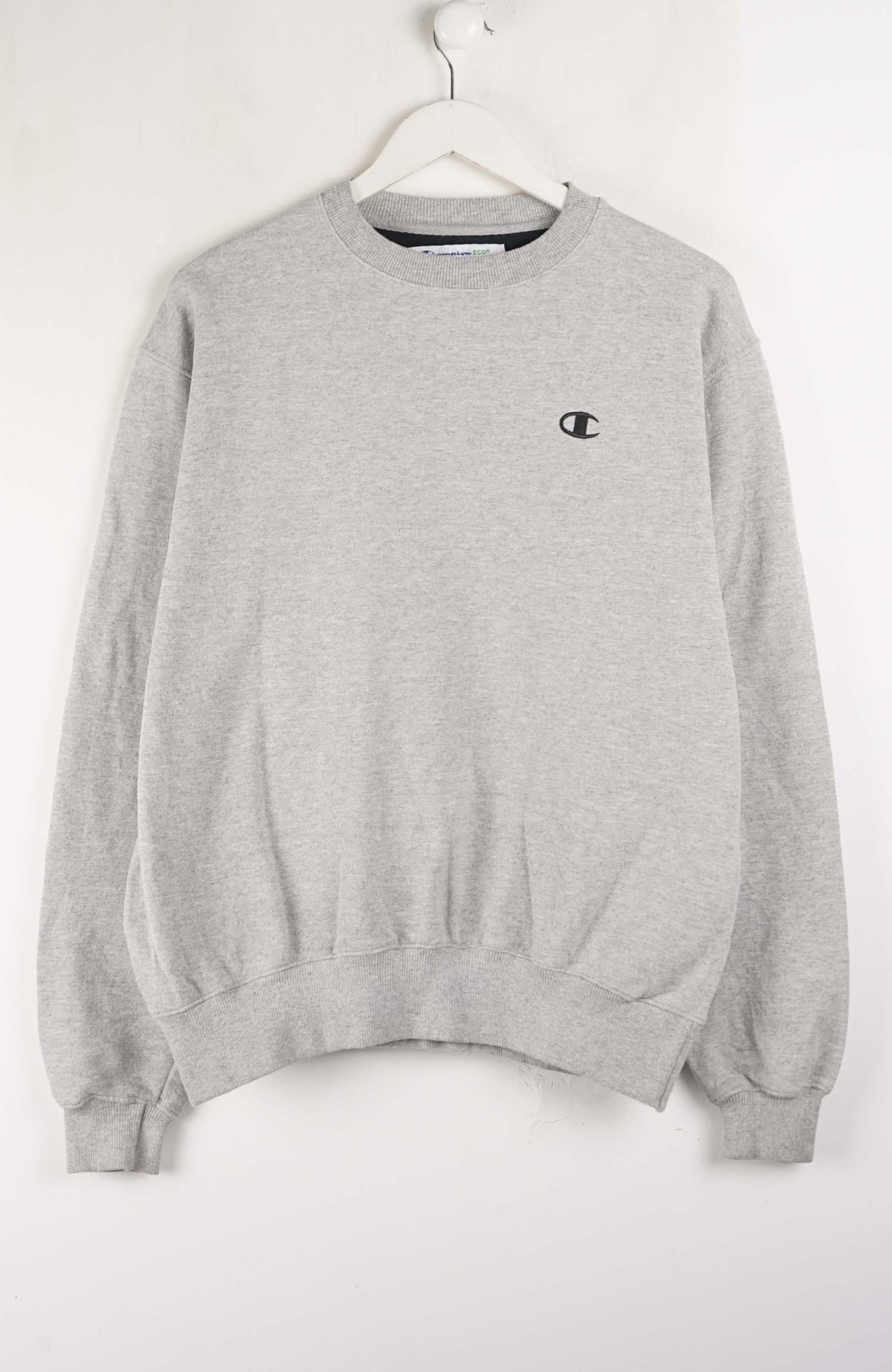 Gray sweatshirt with a small logo on a white background