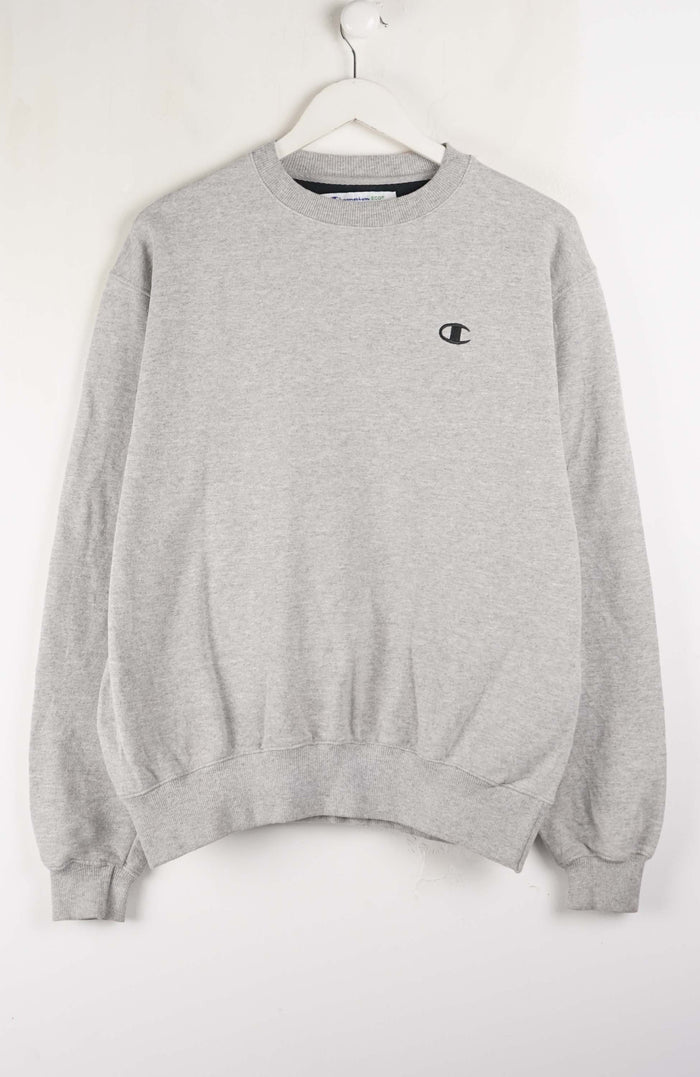 Gray sweatshirt with a small logo on a white background