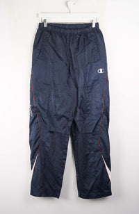 Navy blue pants with Champion logo on a white background