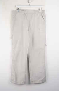 Light gray pants hanging on a white background