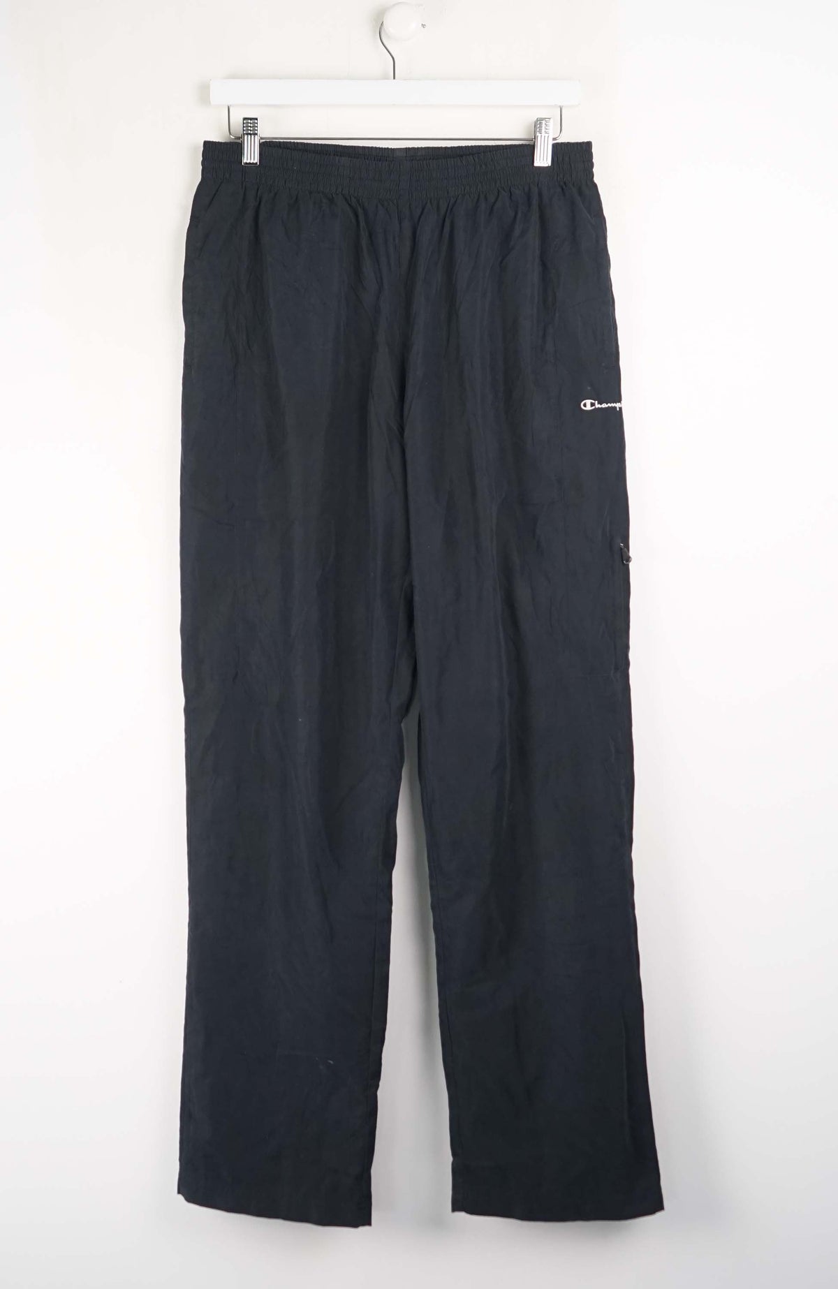 Black pants with a brand logo on a white background