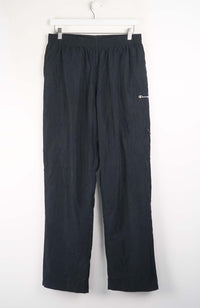 Black pants with a brand logo on a white background
