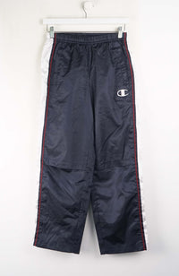 Navy blue pants with a brand logo on a white background