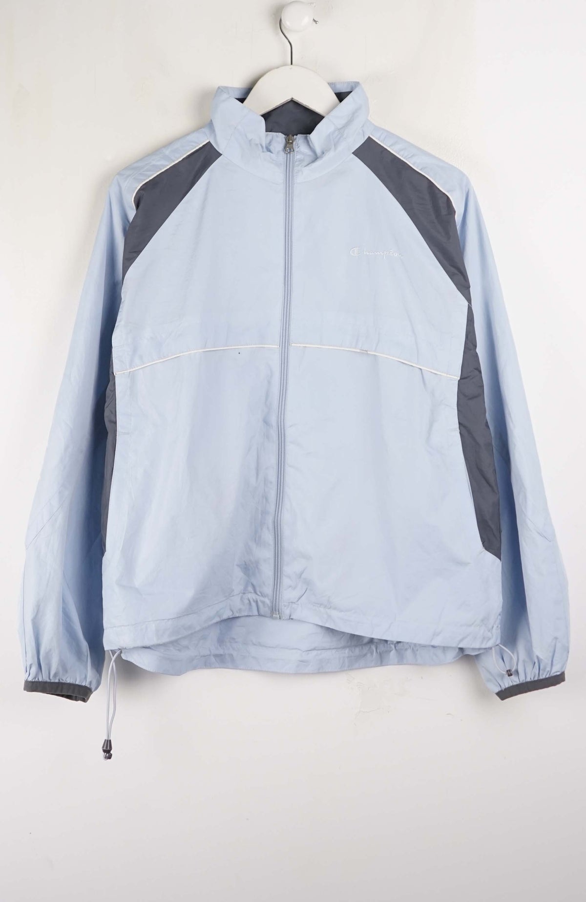 Light blue jacket with gray accents on a white hanger