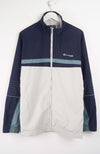 Navy and white jacket with Champion logo on a hanger against a white background