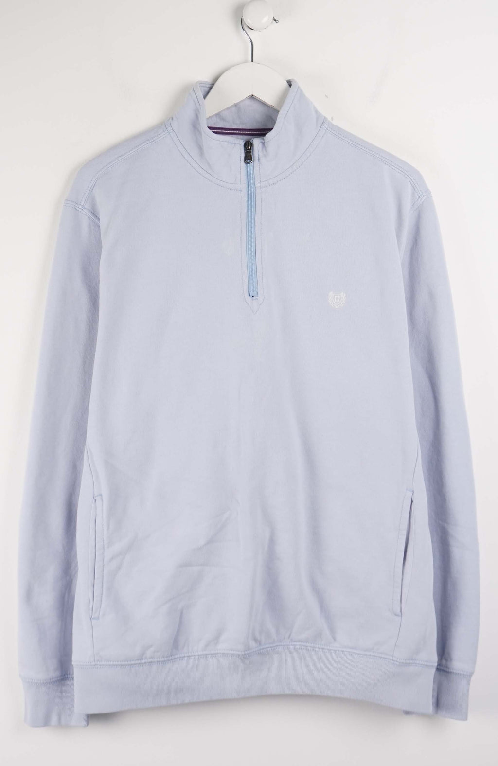 Light blue pullover with a quarter zip on a white background