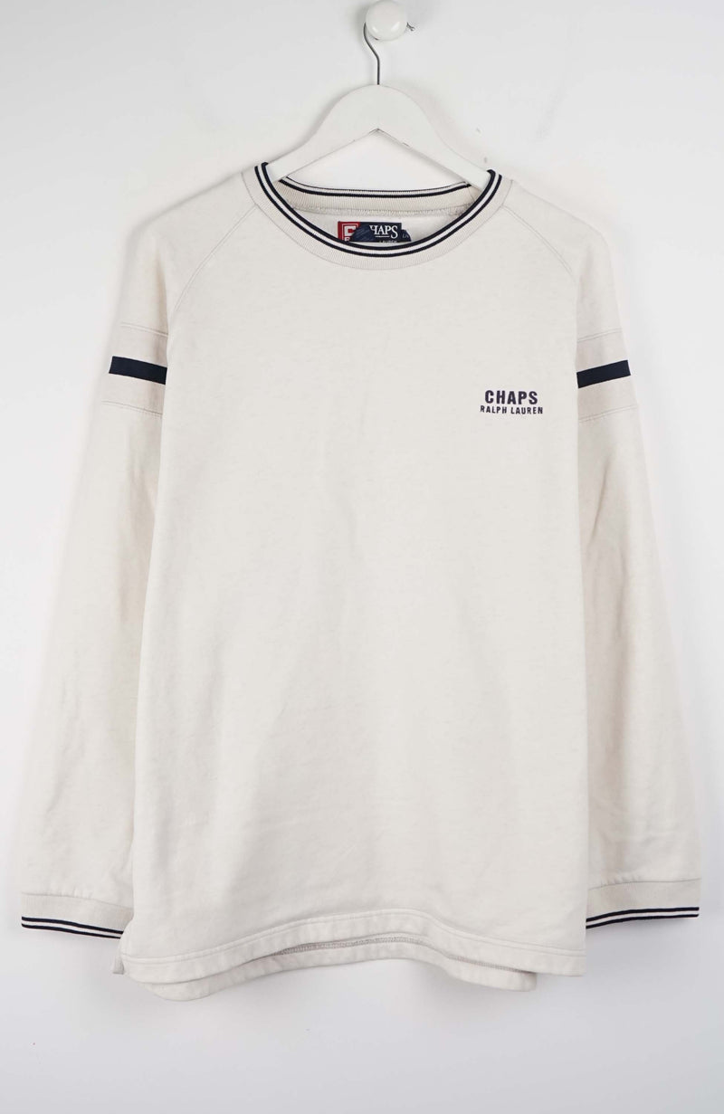 White long-sleeve shirt with black trim on a hanger against a white background