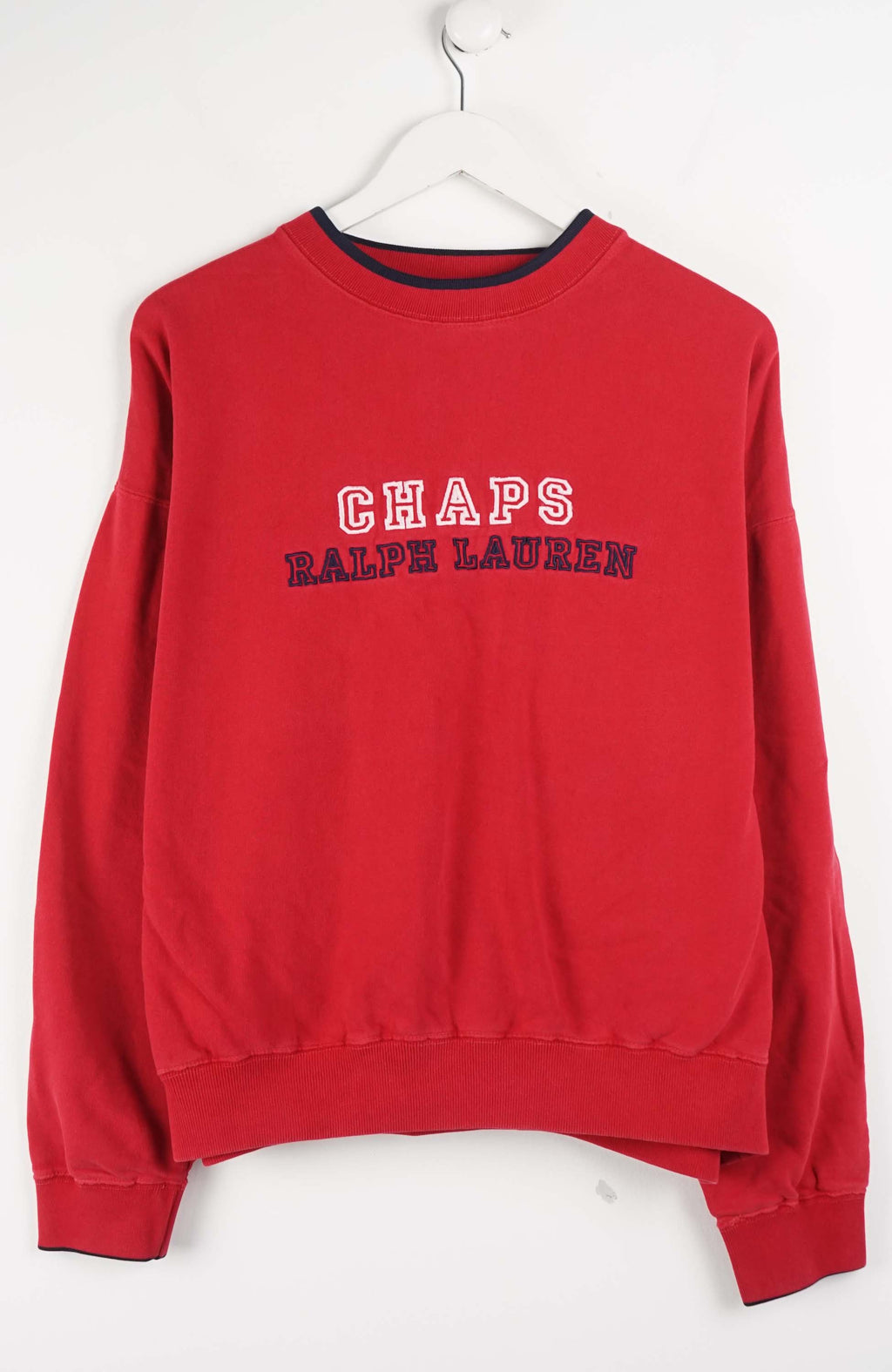 Red sweatshirt with 'CHAPS Ralph Lauren' text on a white background