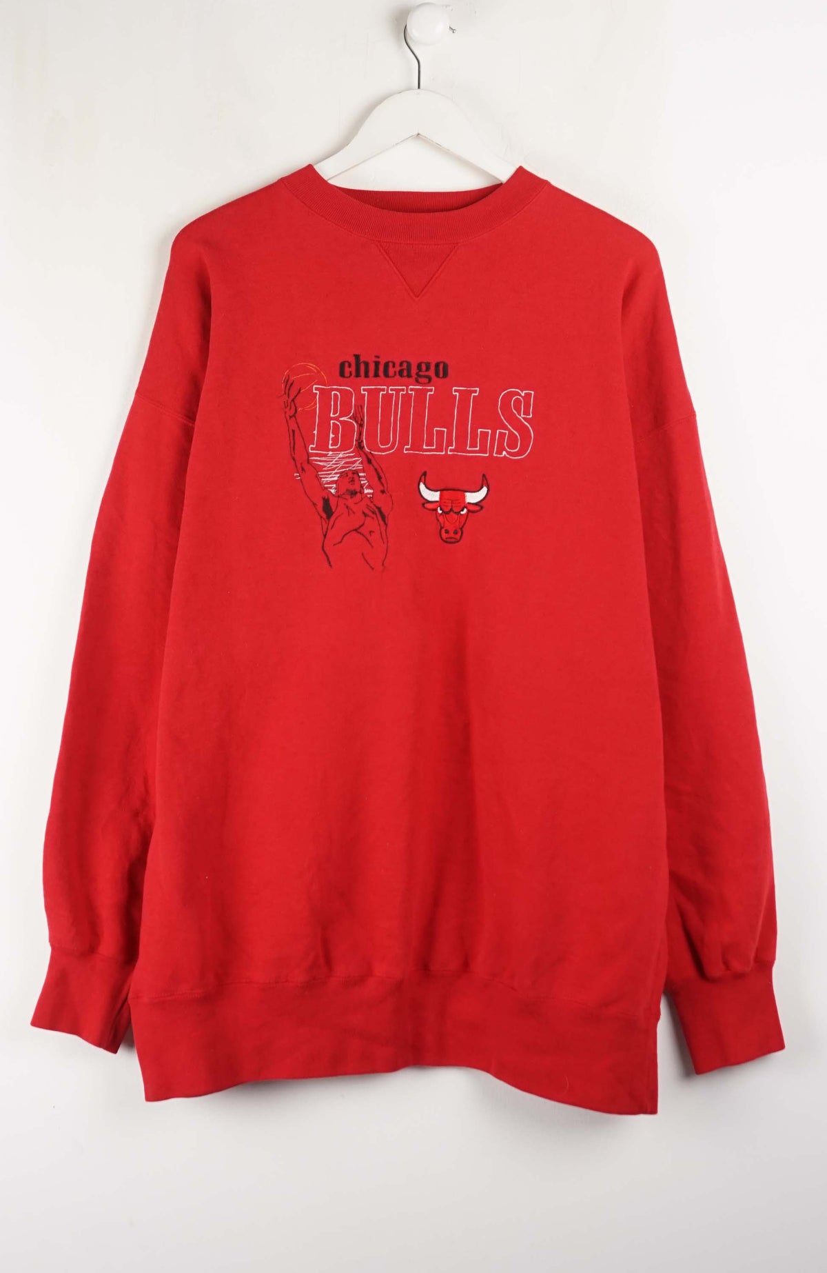 Red sweatshirt with 'Chicago Bulls' logo on a white background