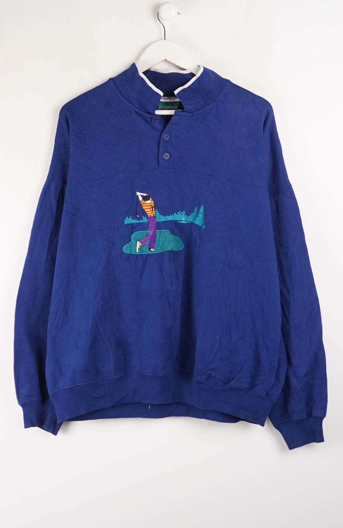 Blue sweatshirt with a graphic design on a white background
