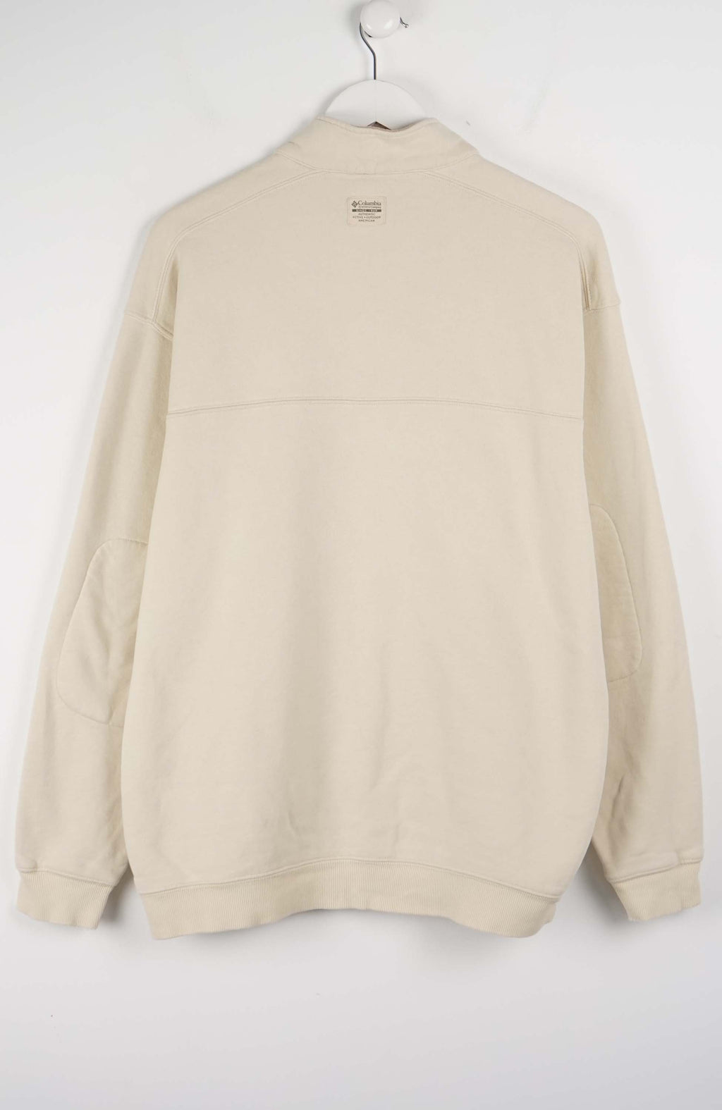 Beige fleece pullover on a hanger against a white background
