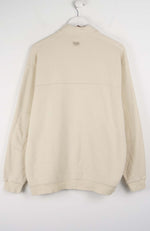 Beige sweatshirt on a white hanger against a white background