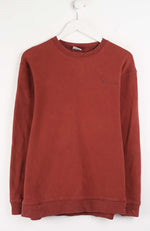 Red sweatshirt on a white hanger against a white background