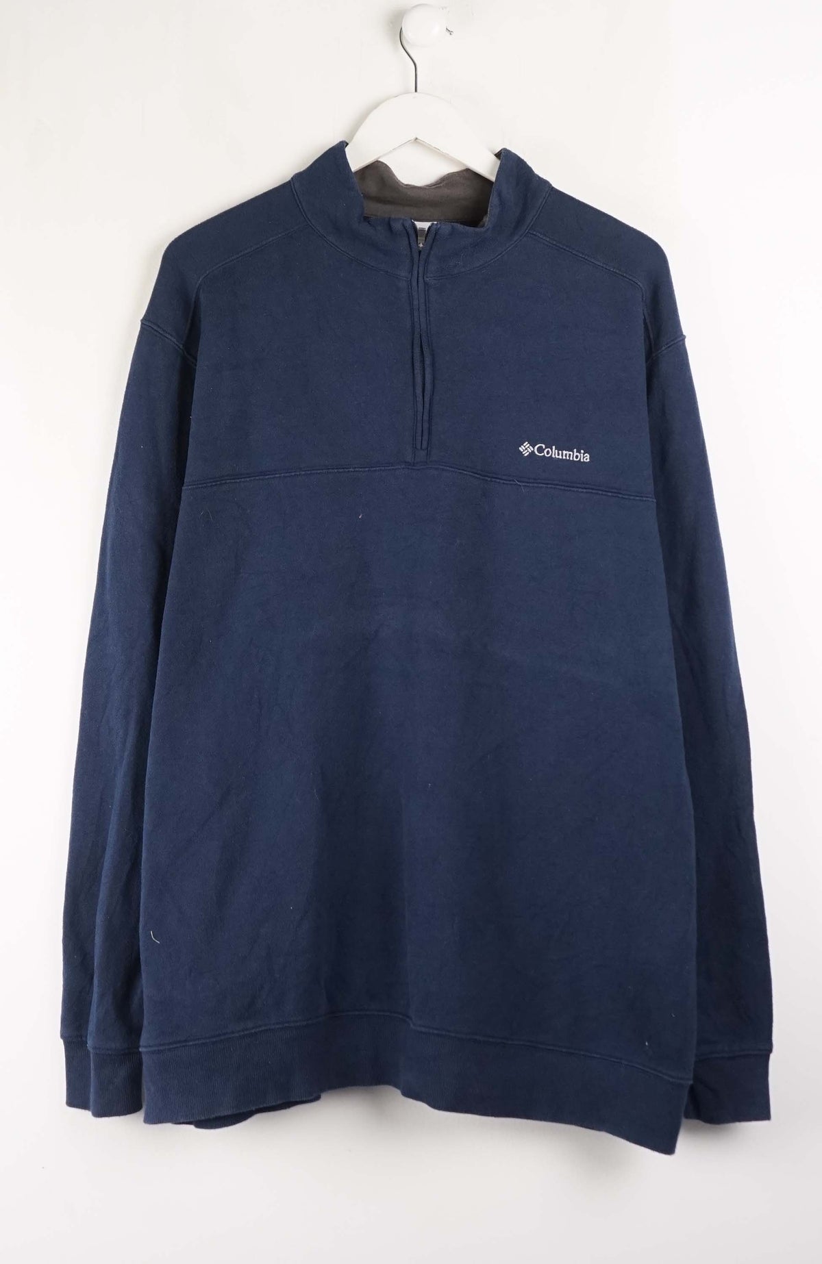 Navy blue pullover with Columbia logo on a white background