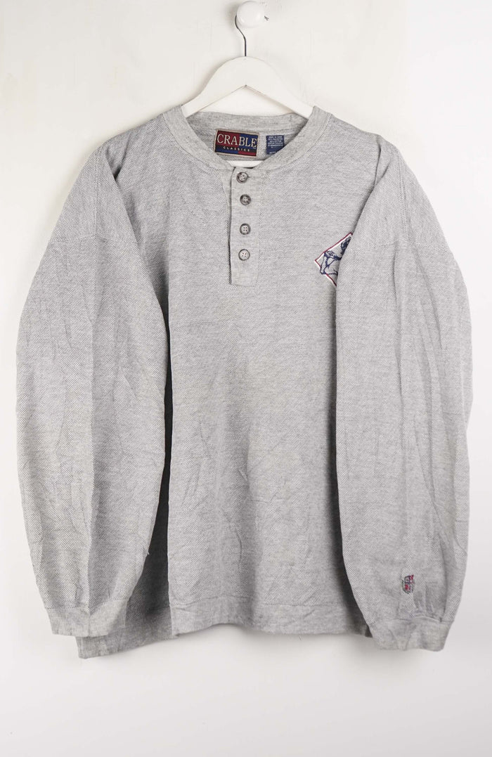 Gray long-sleeve shirt with brand logo on a white background