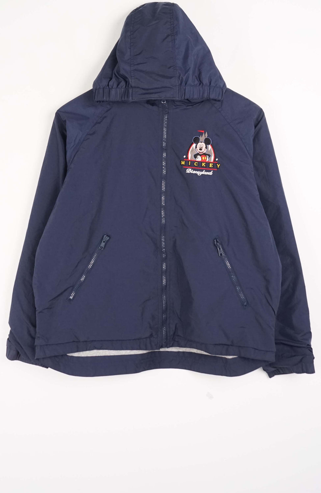 Navy blue jacket with a logo on the chest against a white background