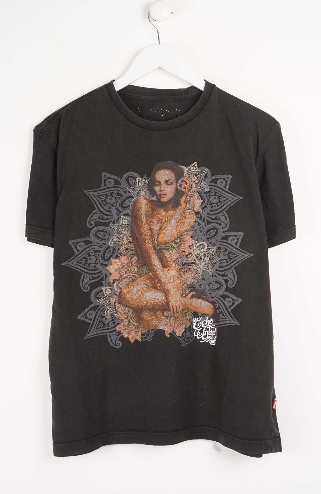 Black t-shirt with a graphic design of a woman and mandala on a white background