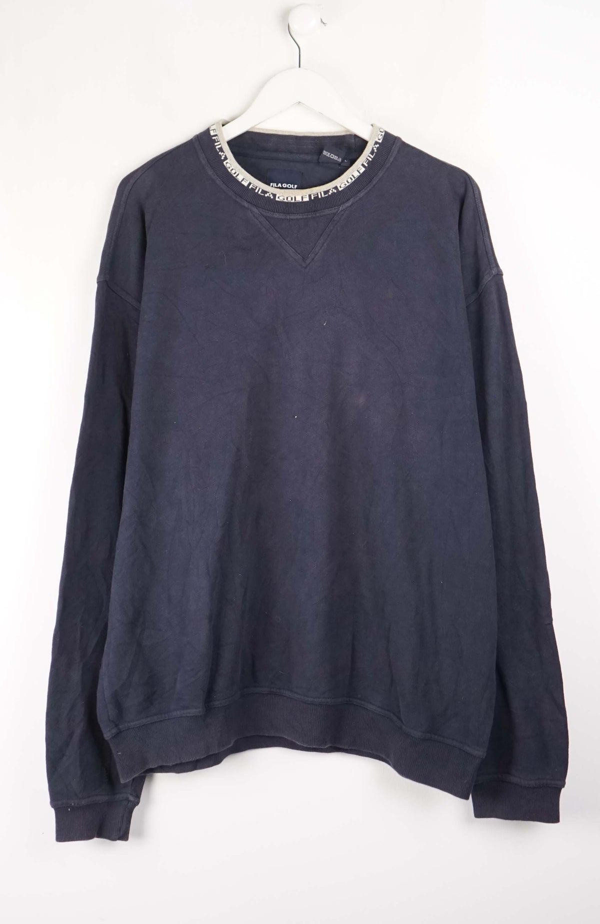 Navy blue sweatshirt on a white hanger against a white background