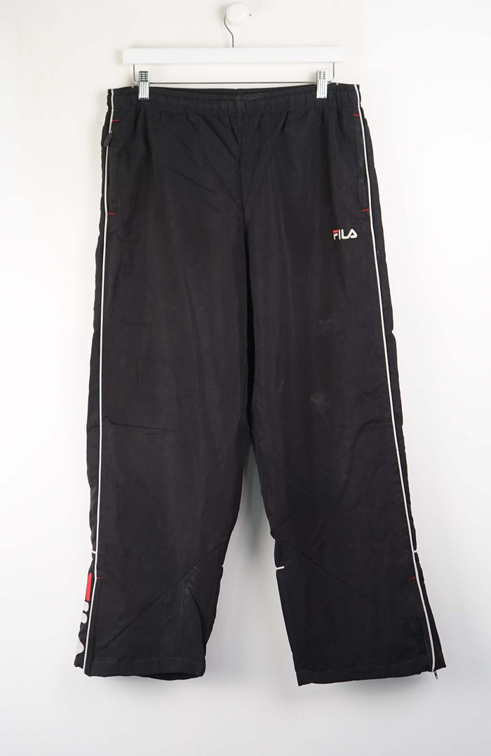 Black pants with white stripes on a white background