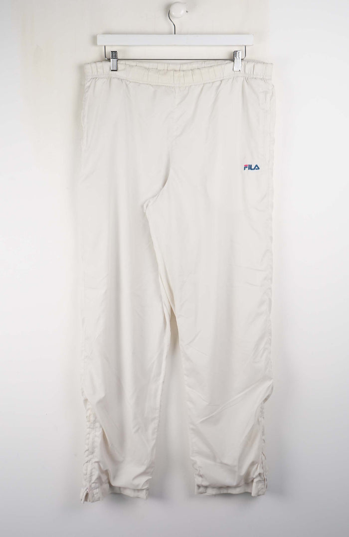 White pants with a visible brand logo on a white background