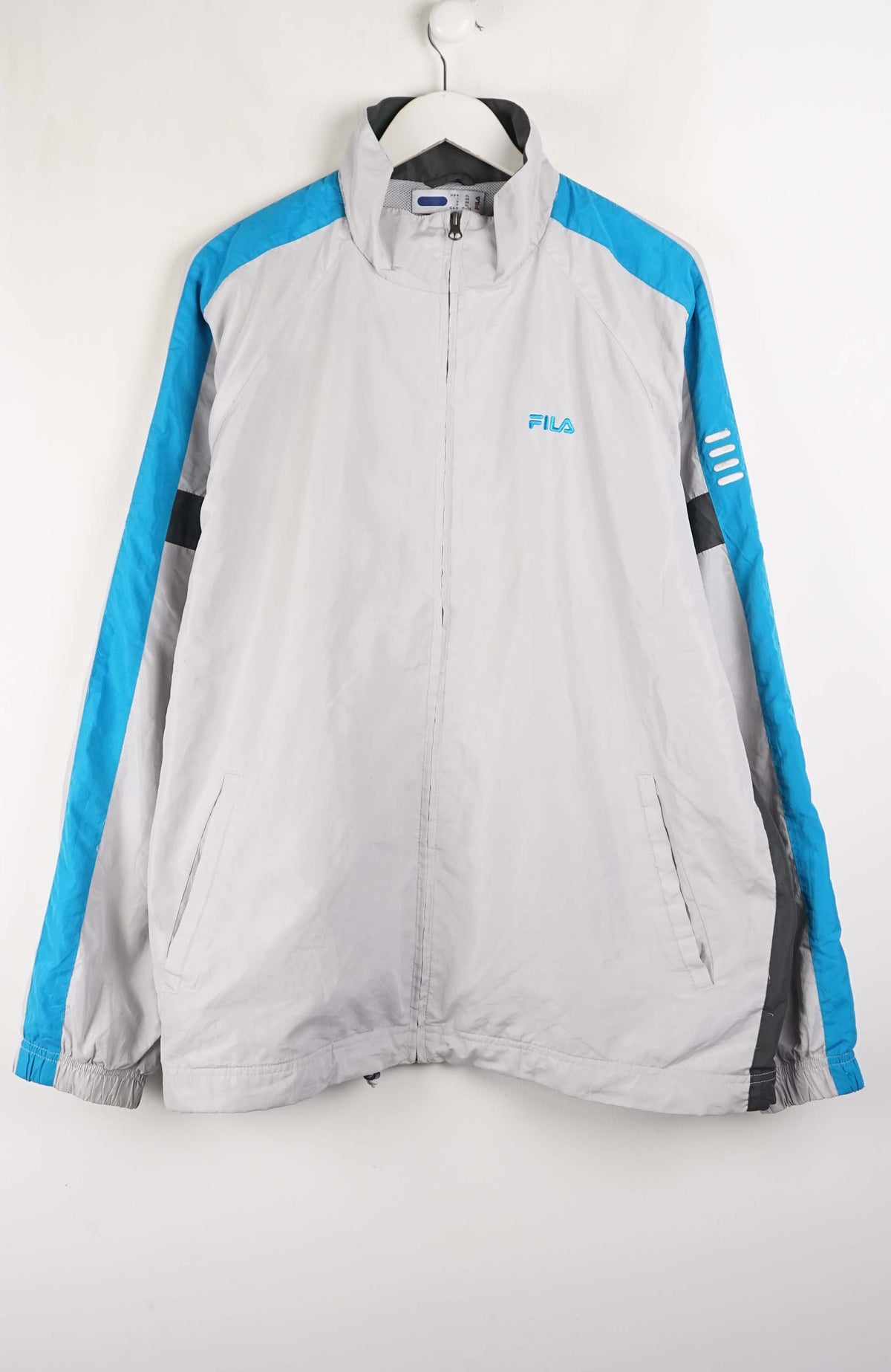 Gray jacket with blue accents on a white background