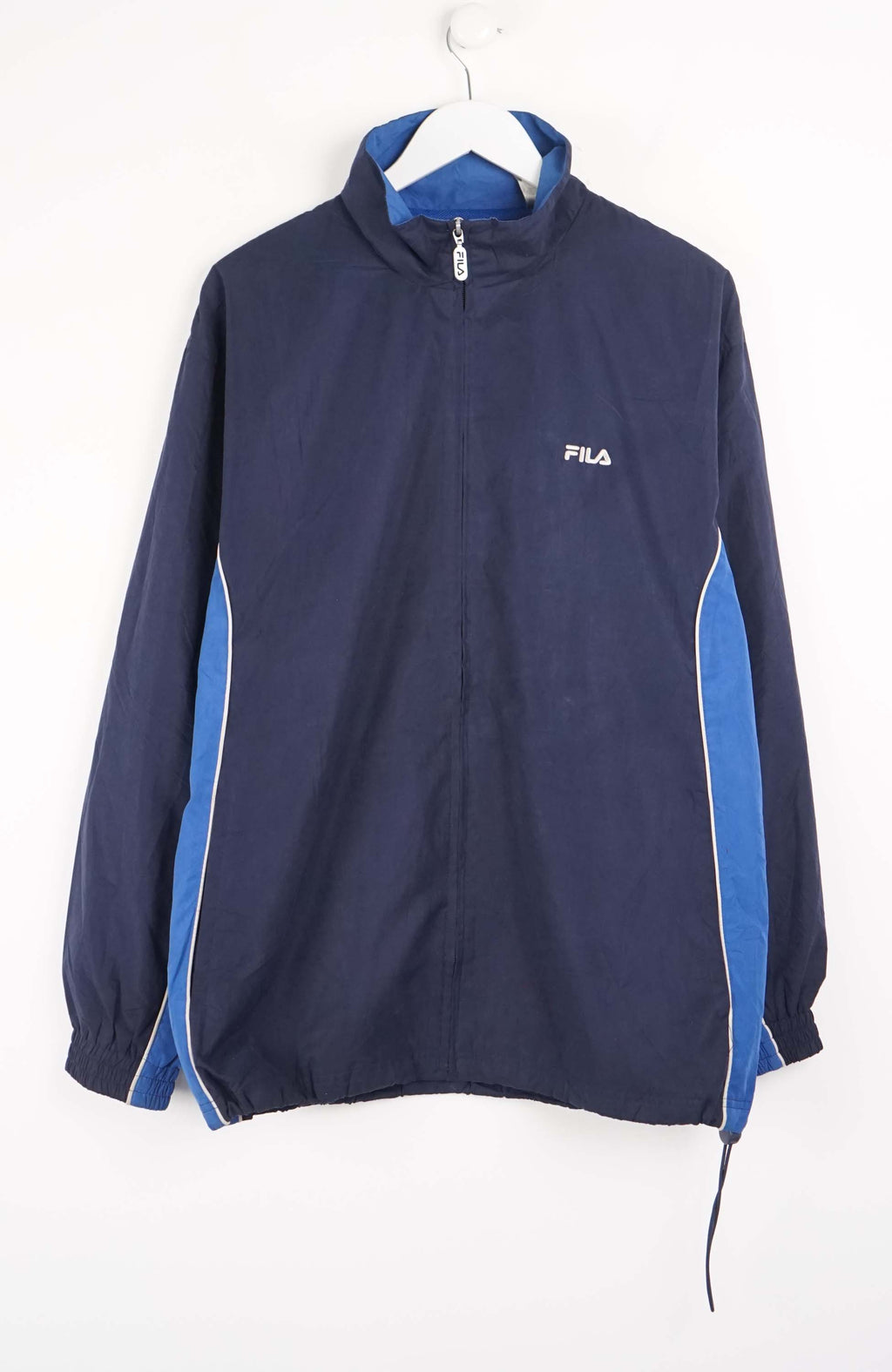 Navy blue jacket with blue accents on a hanger against a white background