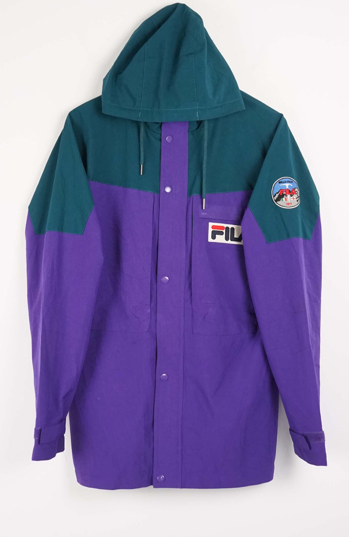 Two-tone teal and purple jacket with a brand logo on a white background