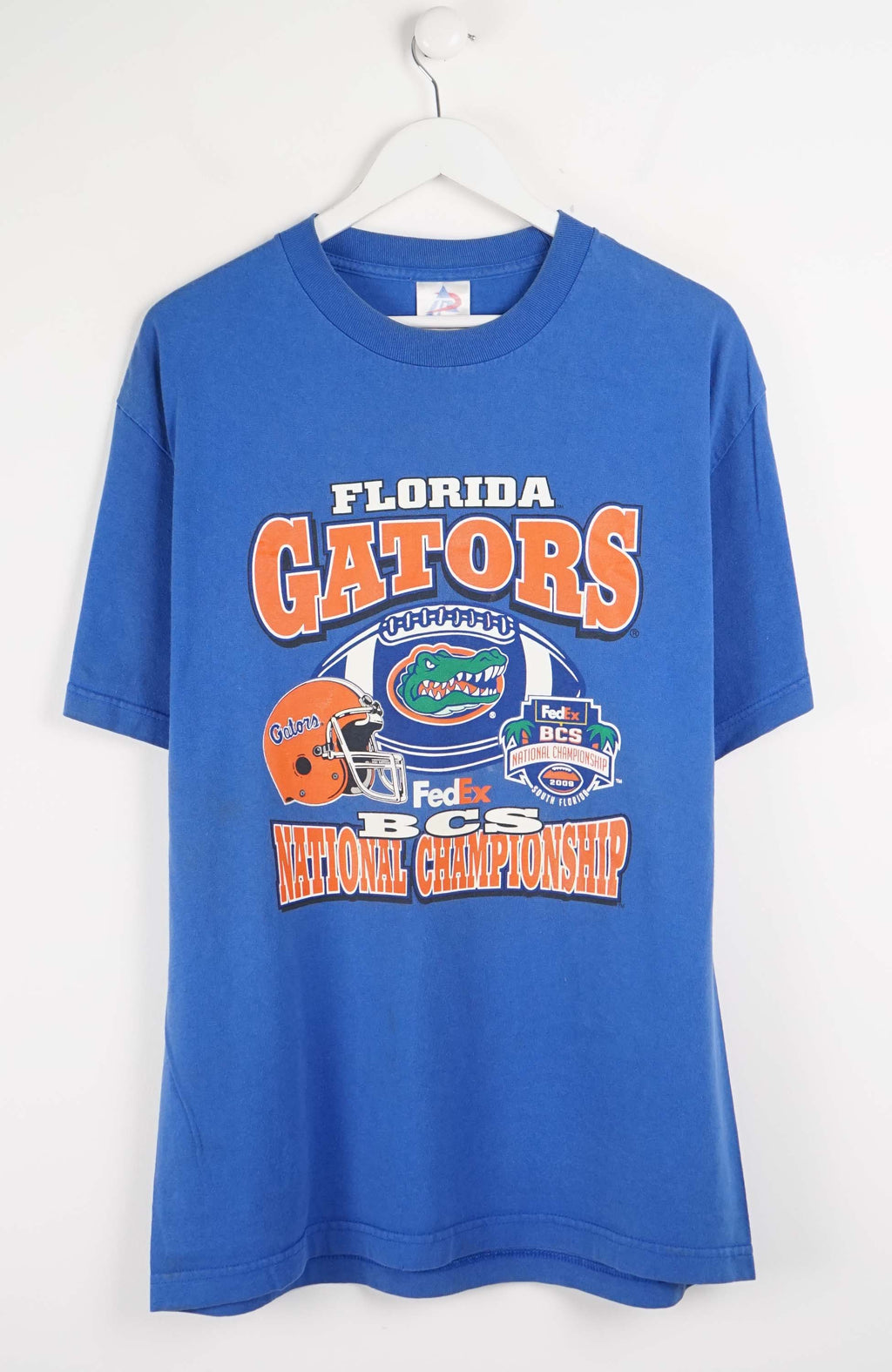 Blue t-shirt with Florida Gators logo and text on a white background