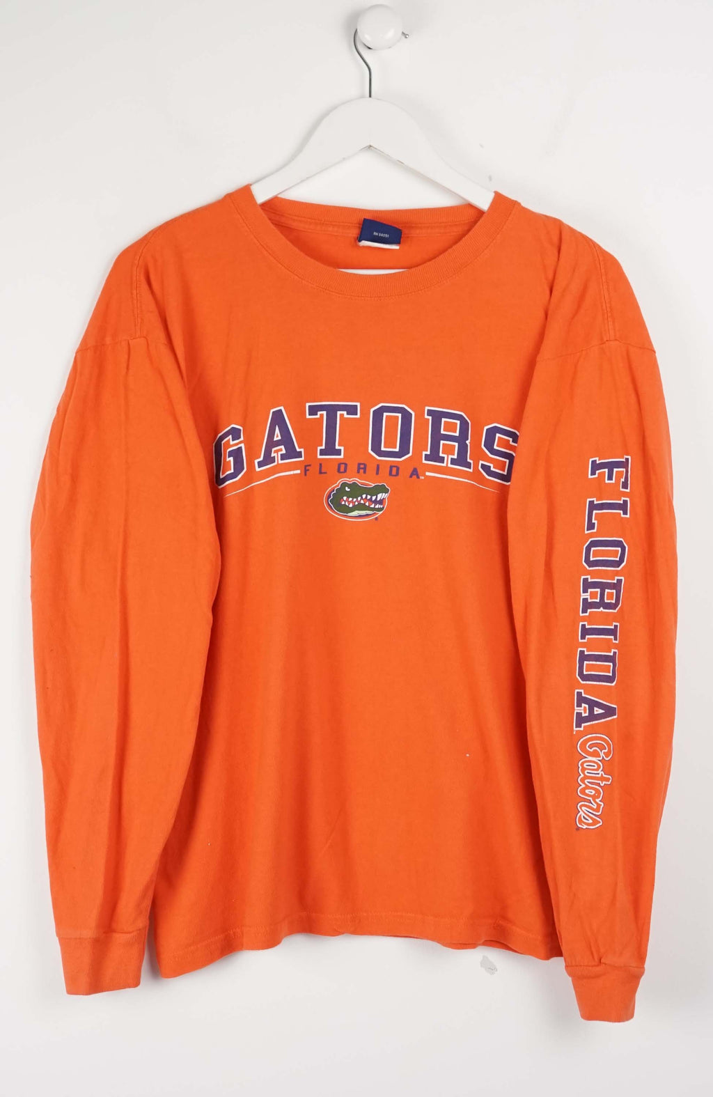 Orange long-sleeve shirt with 'Gators Florida' text on a white background