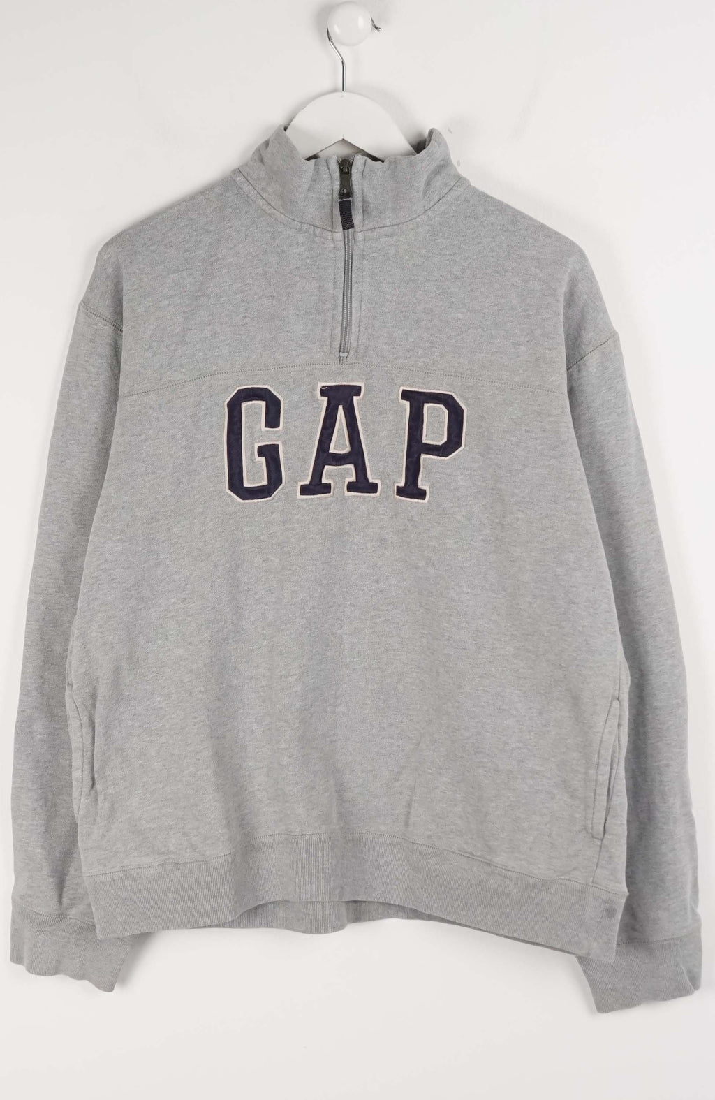 Gray GAP sweatshirt on a white hanger against a white background