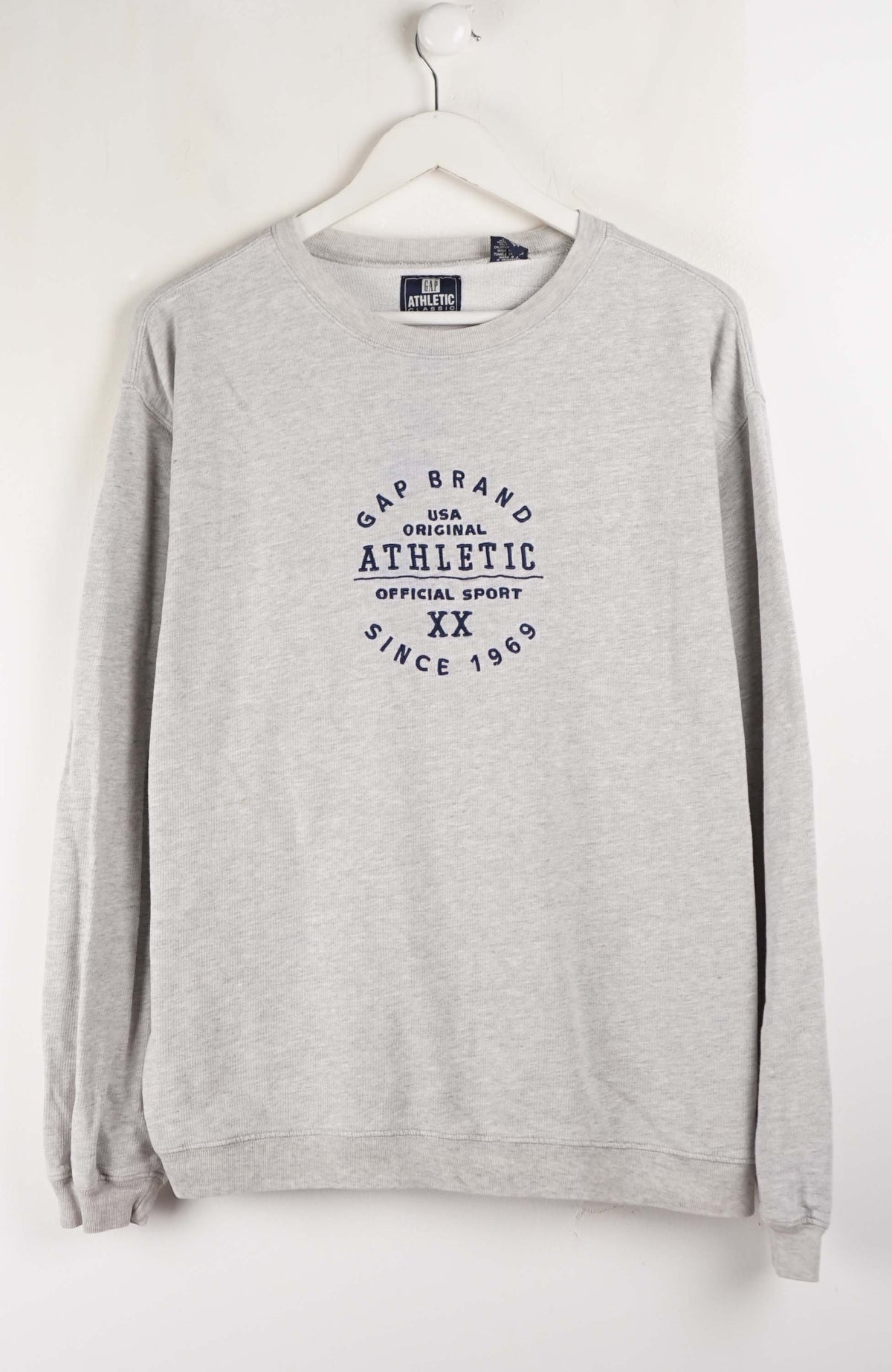 Gray sweatshirt with 'Gap Brand Athletic' text on a white background