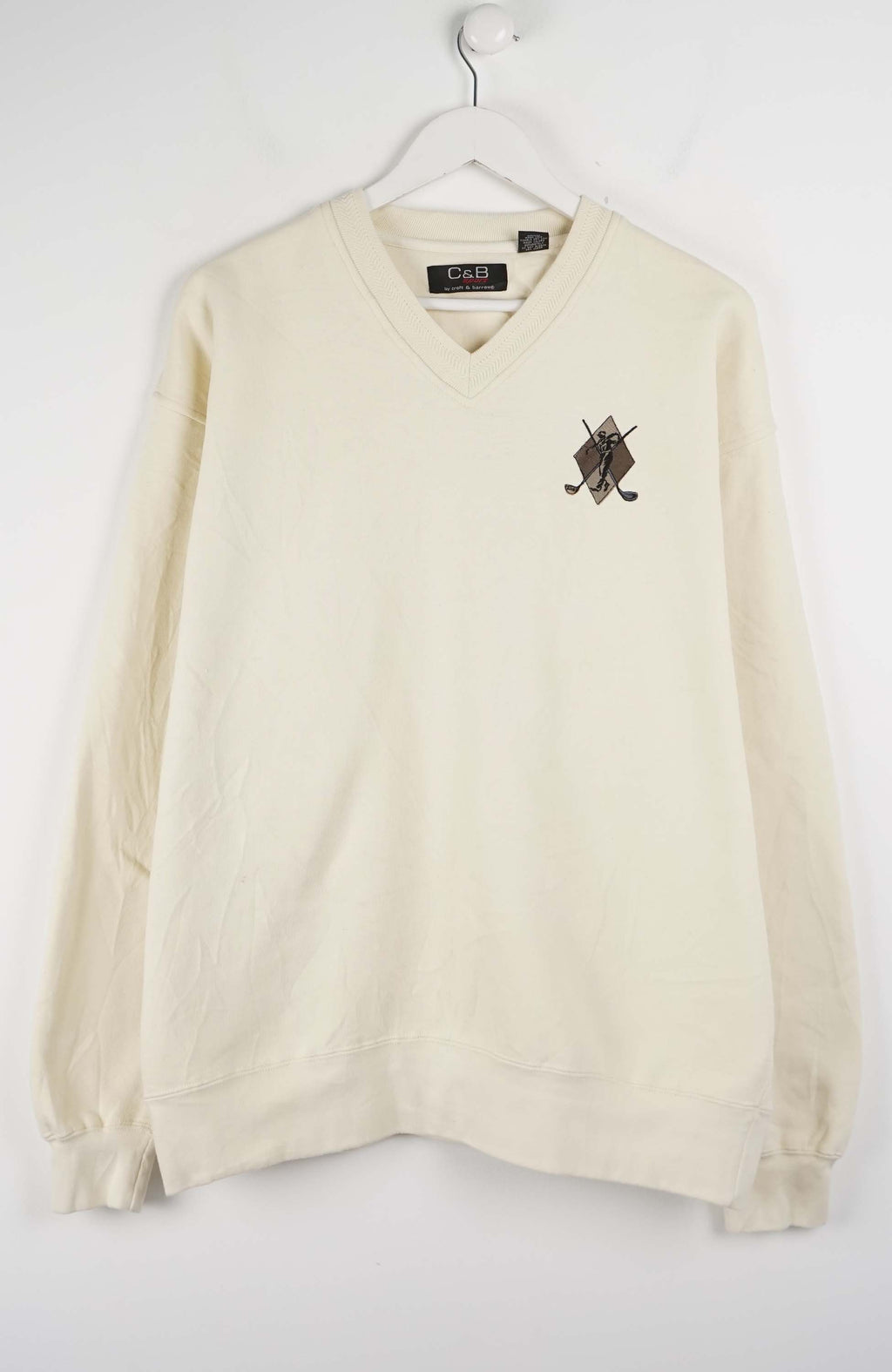 Beige sweater with a logo on a white background