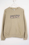 Beige sweatshirt with 'Pebble Beach Golf Links' text on a white background