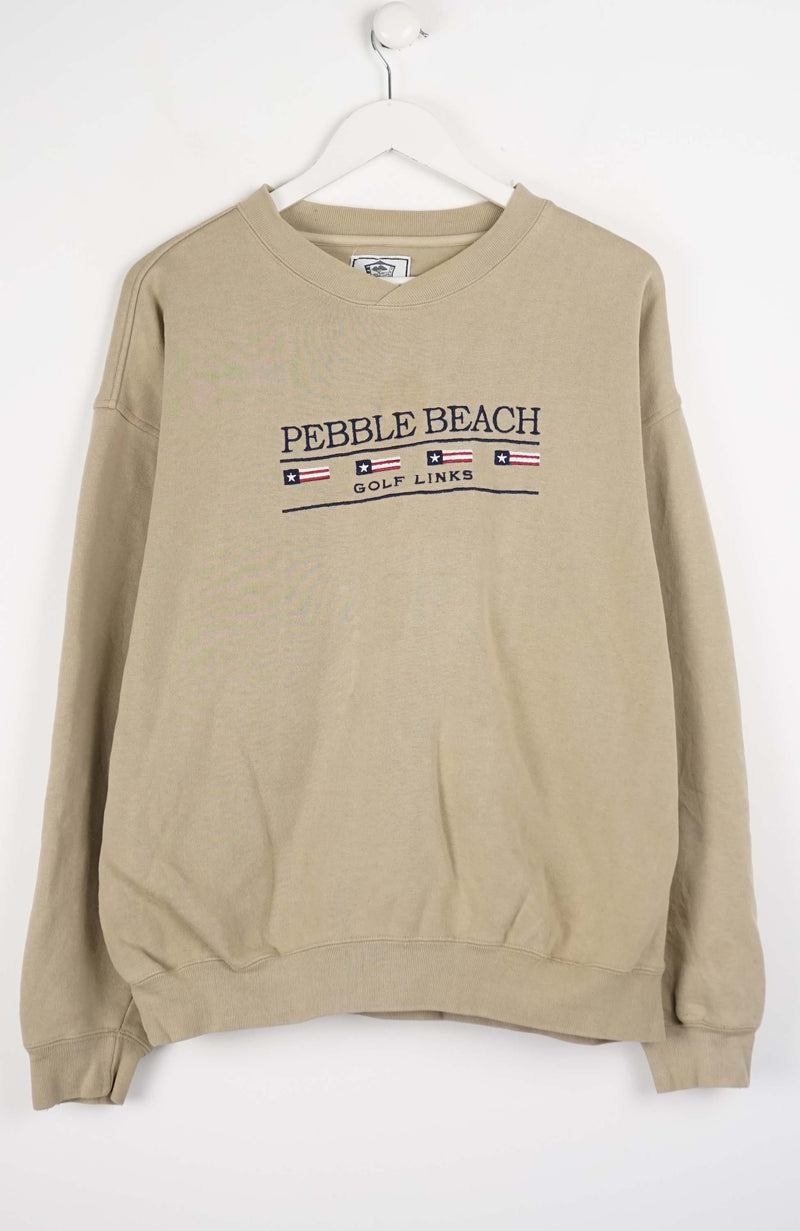 Beige sweatshirt with 'Pebble Beach Golf Links' text on a white background