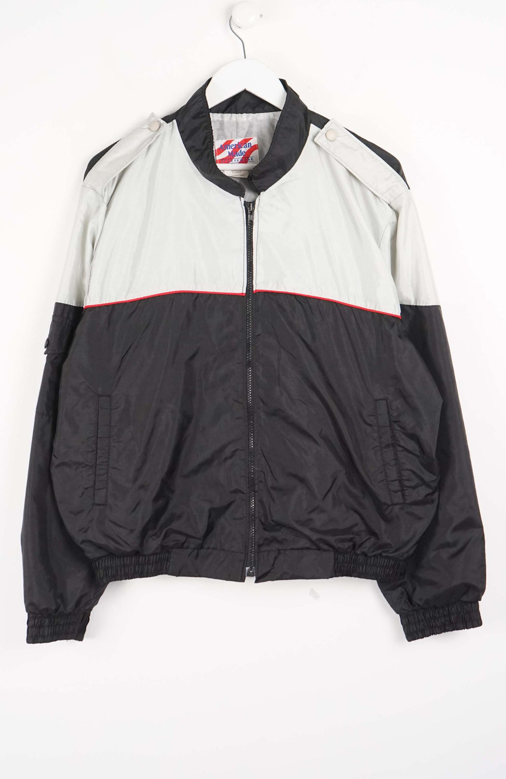 Two-tone jacket with black and gray design on a white background