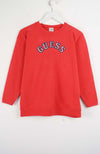 Red sweatshirt with 'Guess' logo on a white background