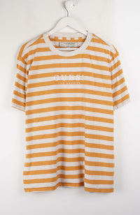 Yellow and white striped t-shirt with 'Guess' logo on a hanger against a white background