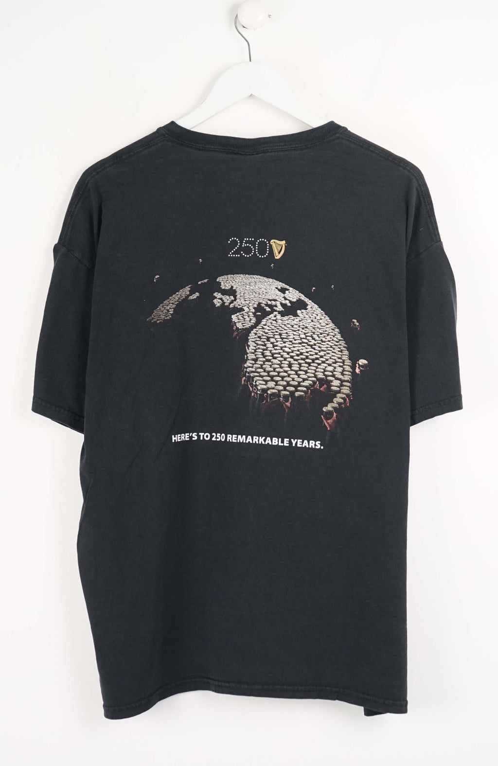 Black t-shirt with Guinness logo on a white background