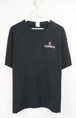 Black t-shirt with Guinness logo on a white background